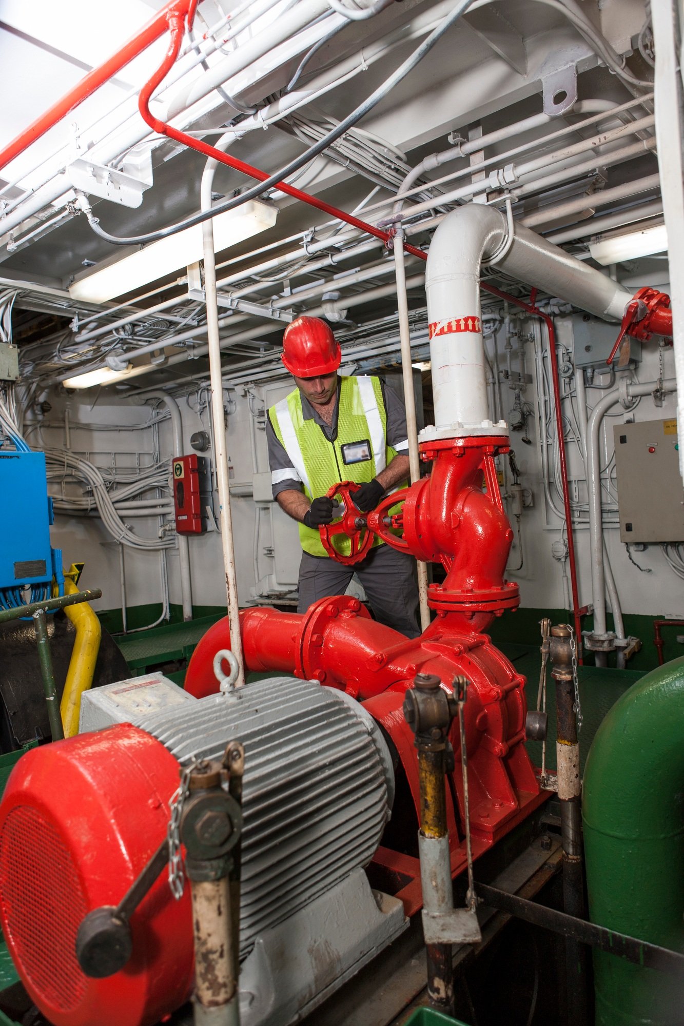 Man working in engine room on a ship